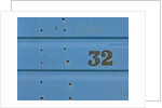 32 Number Sign on Beach hut close-up, Blue Background by Assaf Frank